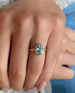 Bespoke aquamarine 21st birthday ring made using her parents’ gold
