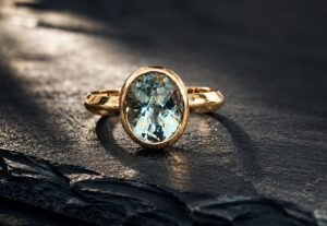 21st birthday aquamarine and gold ring, handmade by Cornovii Silver in Cornwall.